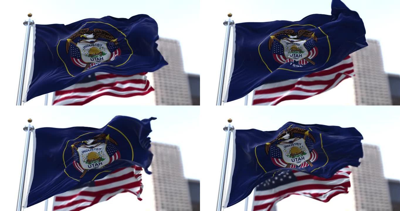 美国犹他州的国旗迎风飘扬，背景是模糊的美国星条旗。