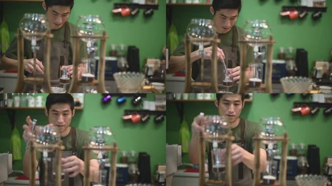 亚洲中国男咖啡师在咖啡馆咖啡店准备冷冲泡冰滴咖啡加冰块