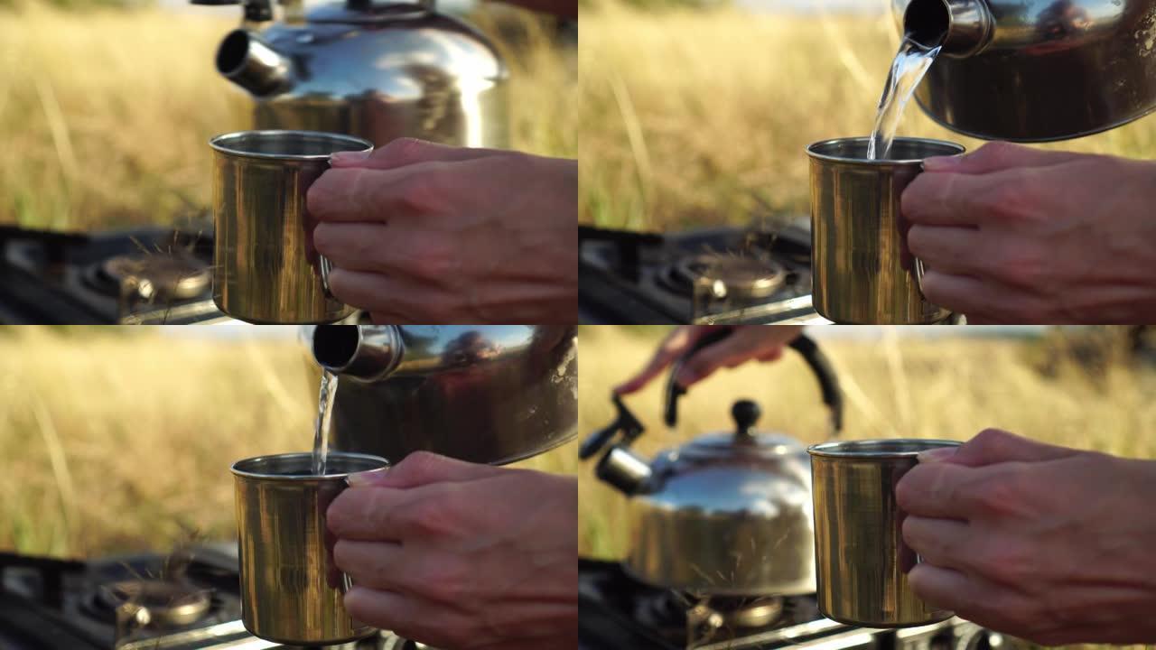 女人的手，从茶壶里把水倒进铁杯里。在自然界中，