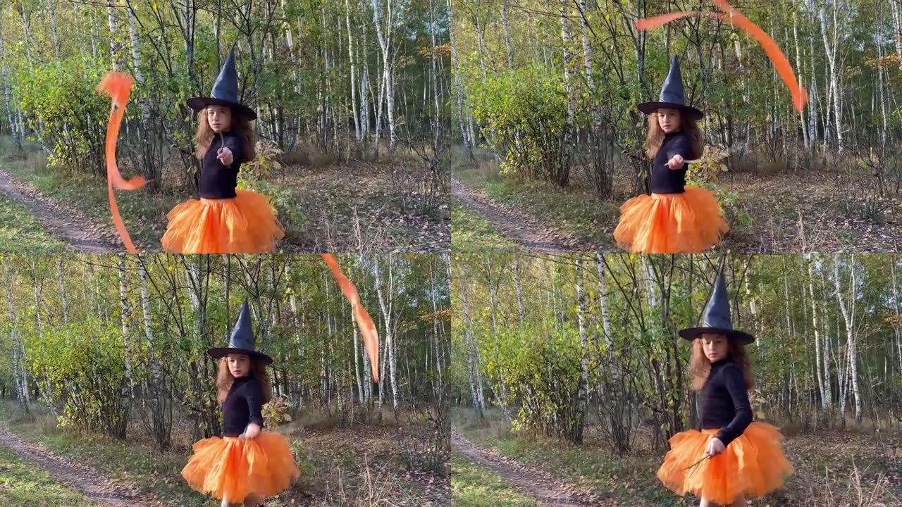 拿着魔杖的小女孩女巫站在森林小路上。万圣节概念。