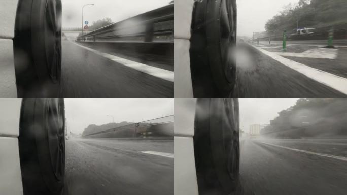 雨天在高速公路上行驶。汽车轮胎和飞溅的水