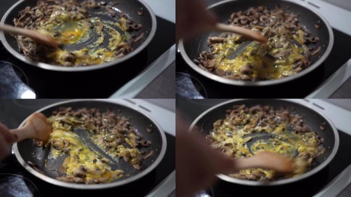 关闭姬松茸双孢菌棉花糖普通蘑菇在锅中烹饪，鸡蛋炒制有机新鲜食品来自农场健康饮食概念