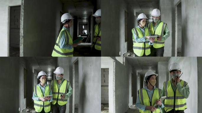 一群穿着反光背心和安全安全帽在施工现场工作的工程师。建筑工程师团队合作的前视图