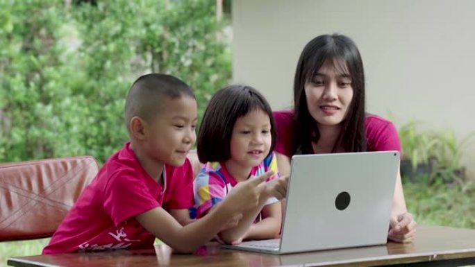 亚洲家庭喜欢在前院或后院的笔记本电脑上提供教学信息。
