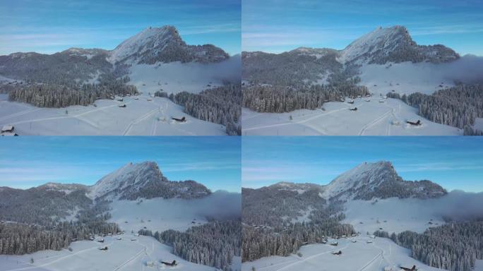 瑞士阿尔卑斯山美丽的冬季仙境的惊人镜头。在格拉鲁斯州，一架无人驾驶飞机在冰雪覆盖的景观上飞行得非常棒