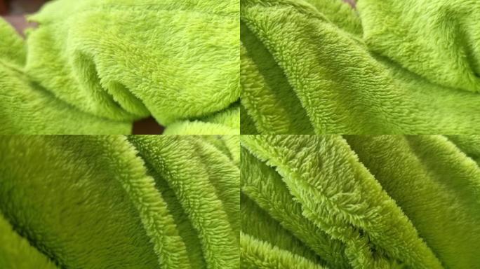 绿色羊毛折痕。织物质地。绿色织物
