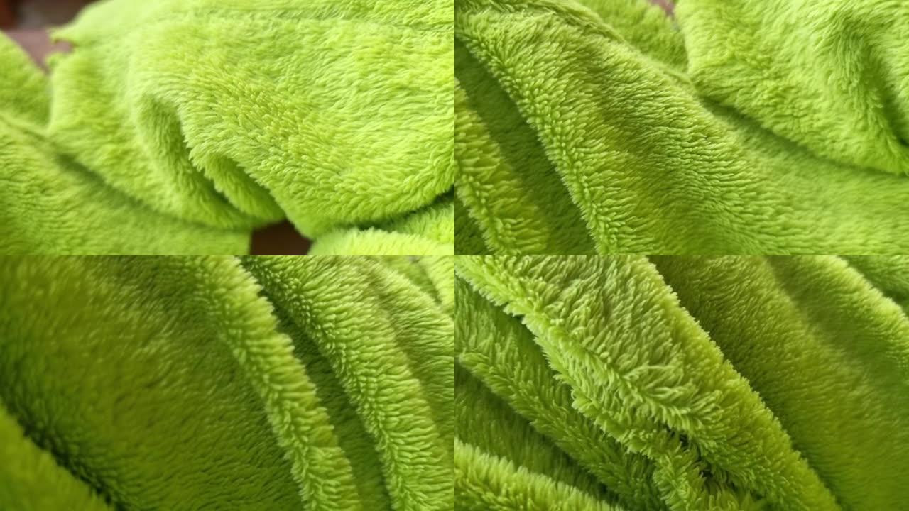 绿色羊毛折痕。织物质地。绿色织物