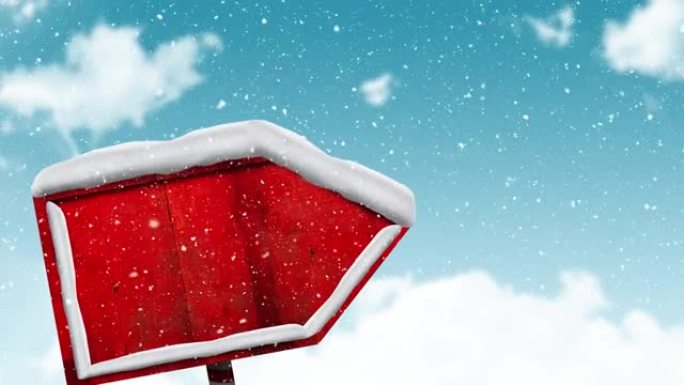 雪落在蓝色天空的冬季景观上的红色标志柱上