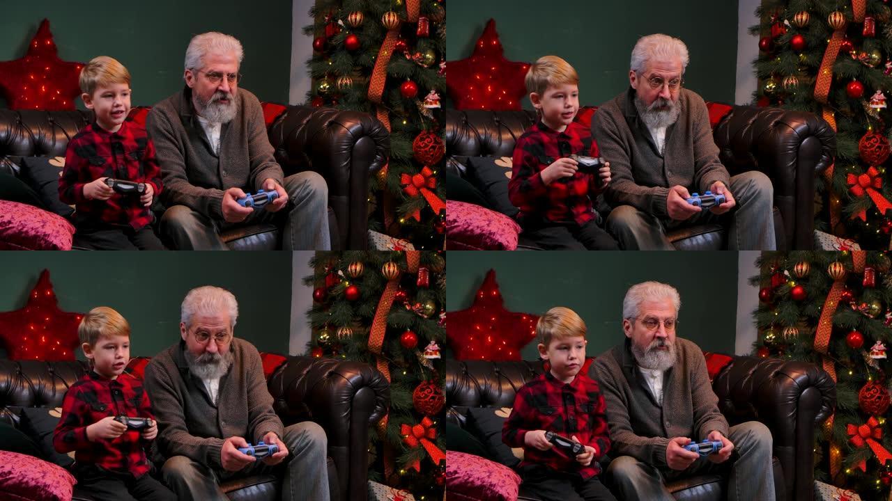 快乐的老爷爷和孙子用操纵杆玩游戏。优雅的白发男子和一个小男孩坐在一个装饰的房间里的沙发上，靠近一棵发