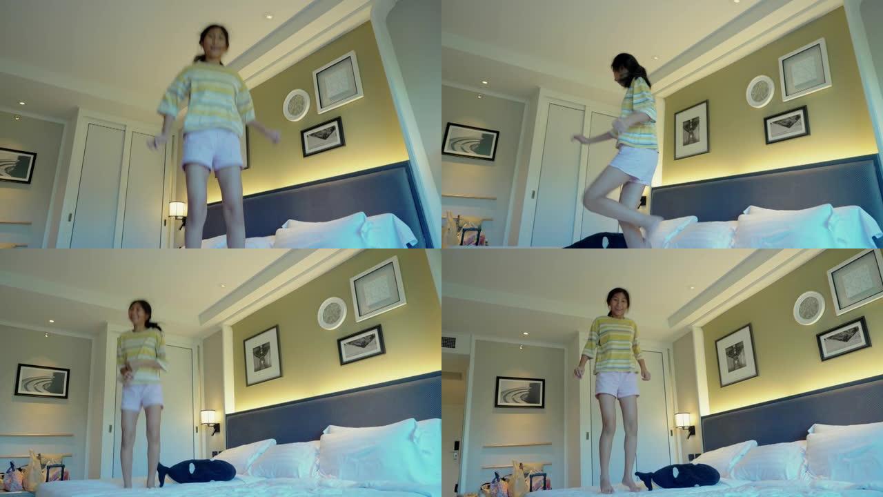 假期，微笑的亚洲女孩躺在酒店的床上，生活方式理念。