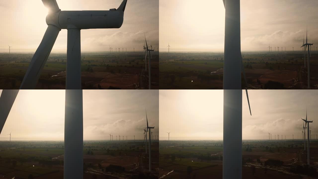近距离拍摄靠近一堆风车的空中飞行。