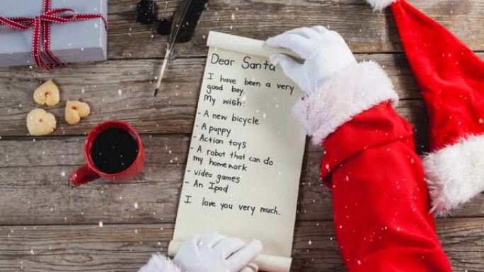 下雪的动画落在桌子上给圣诞老人的信上