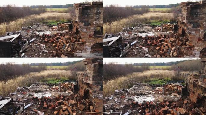 一栋烧坏的农村房子，有砖烤箱，鸟瞰图。