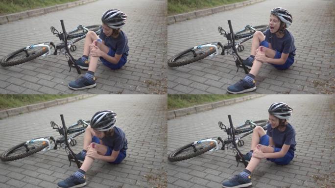 从自行车上摔下来后受伤的男孩