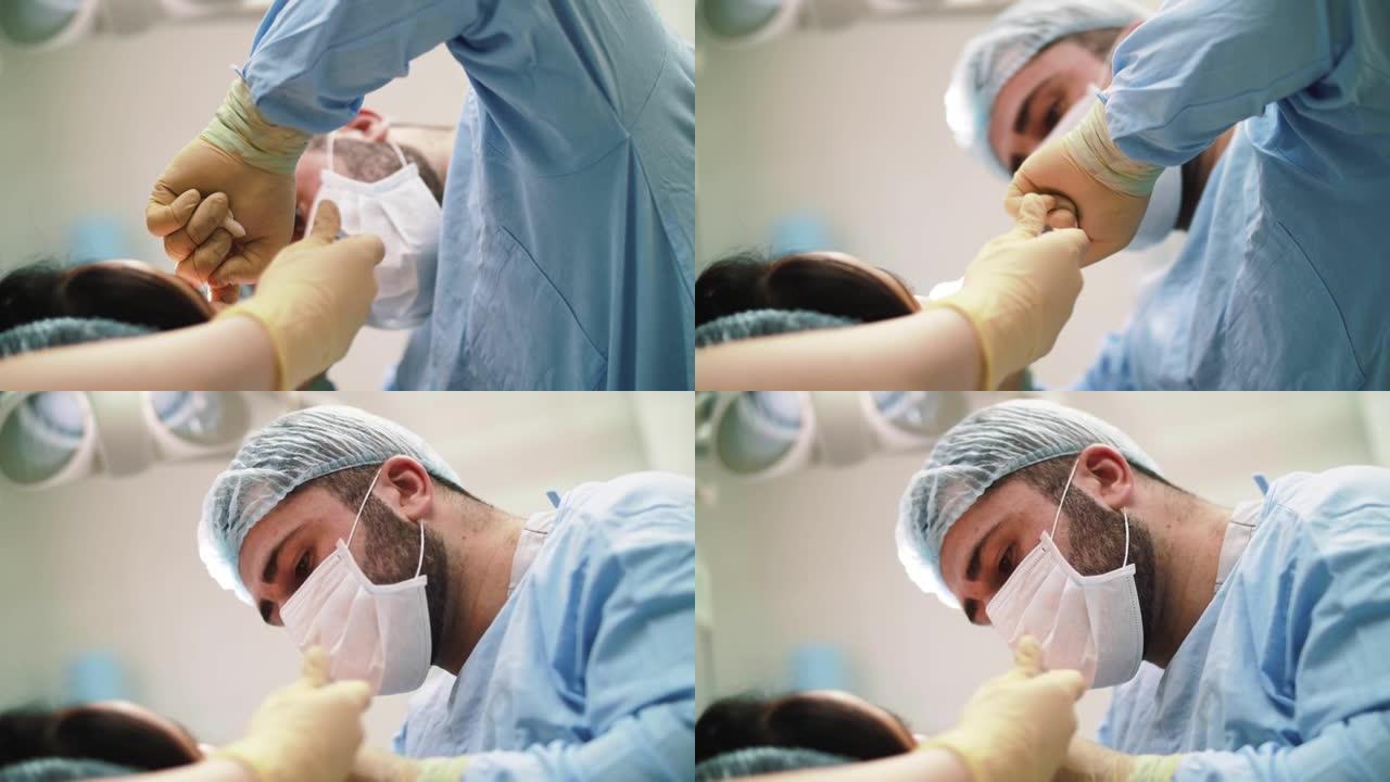 一名外科医生进行面部和手部手术特写