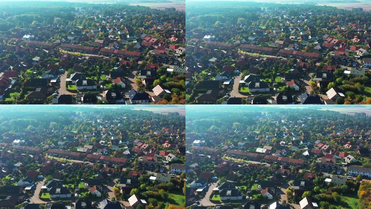 德国郊区边缘的飞行鸟瞰图，街道和房屋处于松散的发展之中