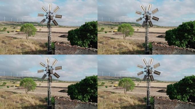 农场的后院风车和背景中的许多风电场。