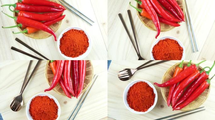 韩国胡椒和红辣椒在木盘，韩国辣椒粉在木桌背景。