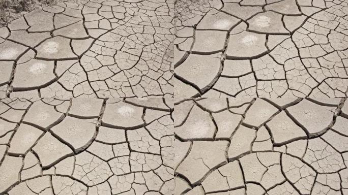 在犹他州干旱期间，在破裂的泥浆上平移观察纹理