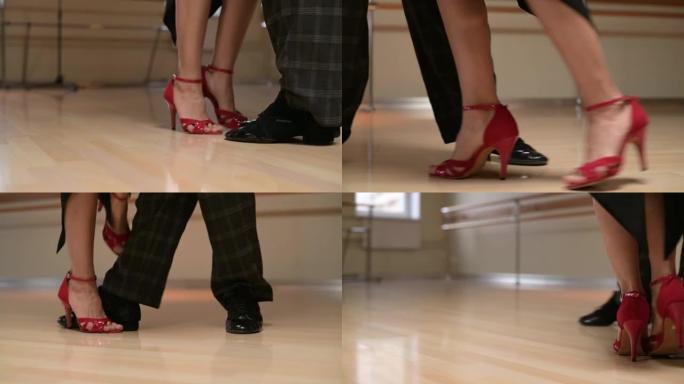 男人和女人探戈舞。腿的特写。情侣在课堂上跳舞