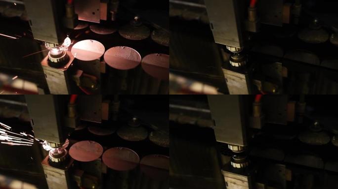 激光机在金属板上切割孔特写4k电影慢动作
