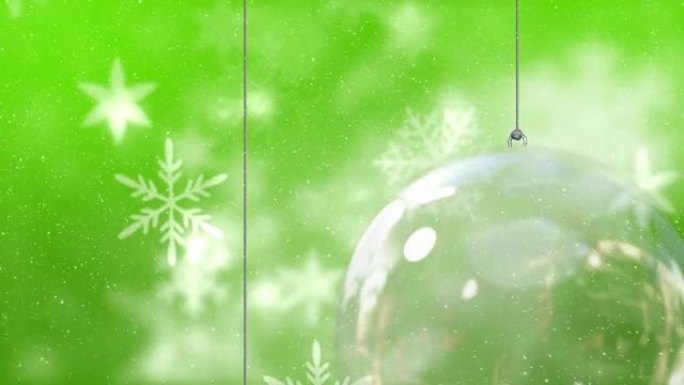 雪花飘落的动画和绿色背景上的圣诞节摆设