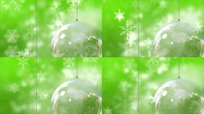 雪花飘落的动画和绿色背景上的圣诞节摆设
