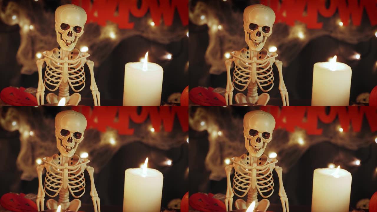 死亡日和万圣节庆祝活动。黑暗的夜晚背景下燃烧蜡烛的骨架。万圣节快乐。不给糖就捣蛋。万圣节装饰