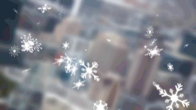 多个雪花图标落在模糊的城市景观的鸟瞰图上