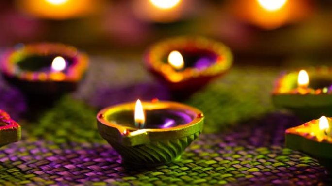 紫色到绿色编织表面发光的排灯节蜡烛视频