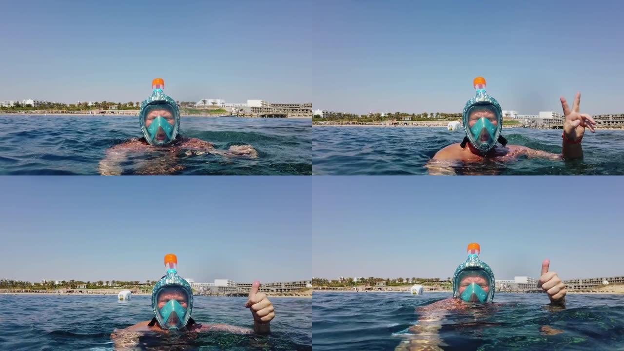 浮潜。游泳。潜水。快乐的浮潜者。一个戴着浮潜面具的男人正在探索水下珊瑚礁，里面有无数五颜六色的异国情