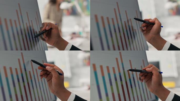 电脑显示器特写条形图显示黑皮肤男人手握笔触屏用它检查图水平他们的正确性高度统计局营销财务分析