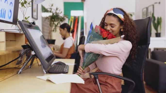 4k视频片段，一名妇女在办公室收到一束红玫瑰