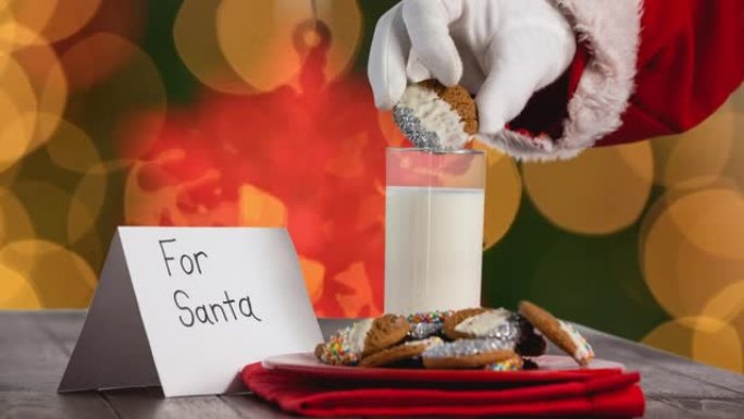 圣诞老人在橙色光点上采摘饼干的动画