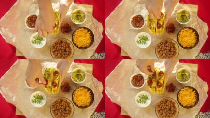 餐桌上的墨西哥食物特写。传统特克斯墨西哥美食。煮熟的炸玉米饼配以肉和蔬菜，加入切好的樱桃番茄，香菜汤