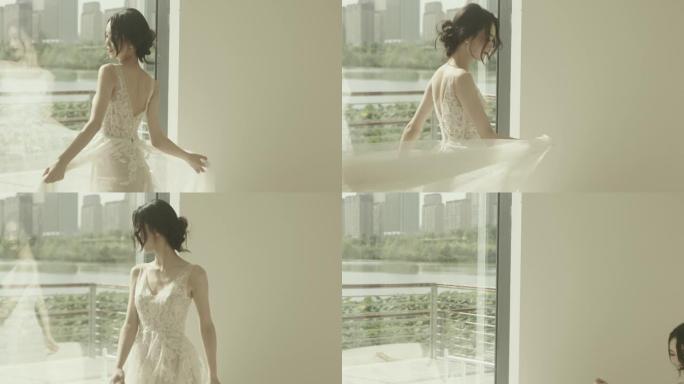 穿着白色婚纱的美丽亚洲新娘，坐在沙发上，开心的表情，慢动作拍摄