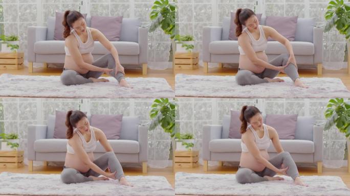 孕妇抚触和按摩小腿腿部如此疼痛和突然抽筋，怀孕的妇女患有小腿腿部抽筋，醒来后肌肉受到压力，怀孕的保健