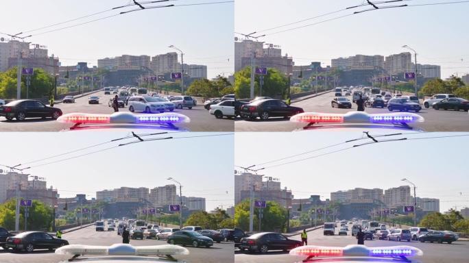 亚美尼亚埃里温-2021年8月27日-值班交通管制警察在路口显示汽车标志。故意模糊道路控制概念背景