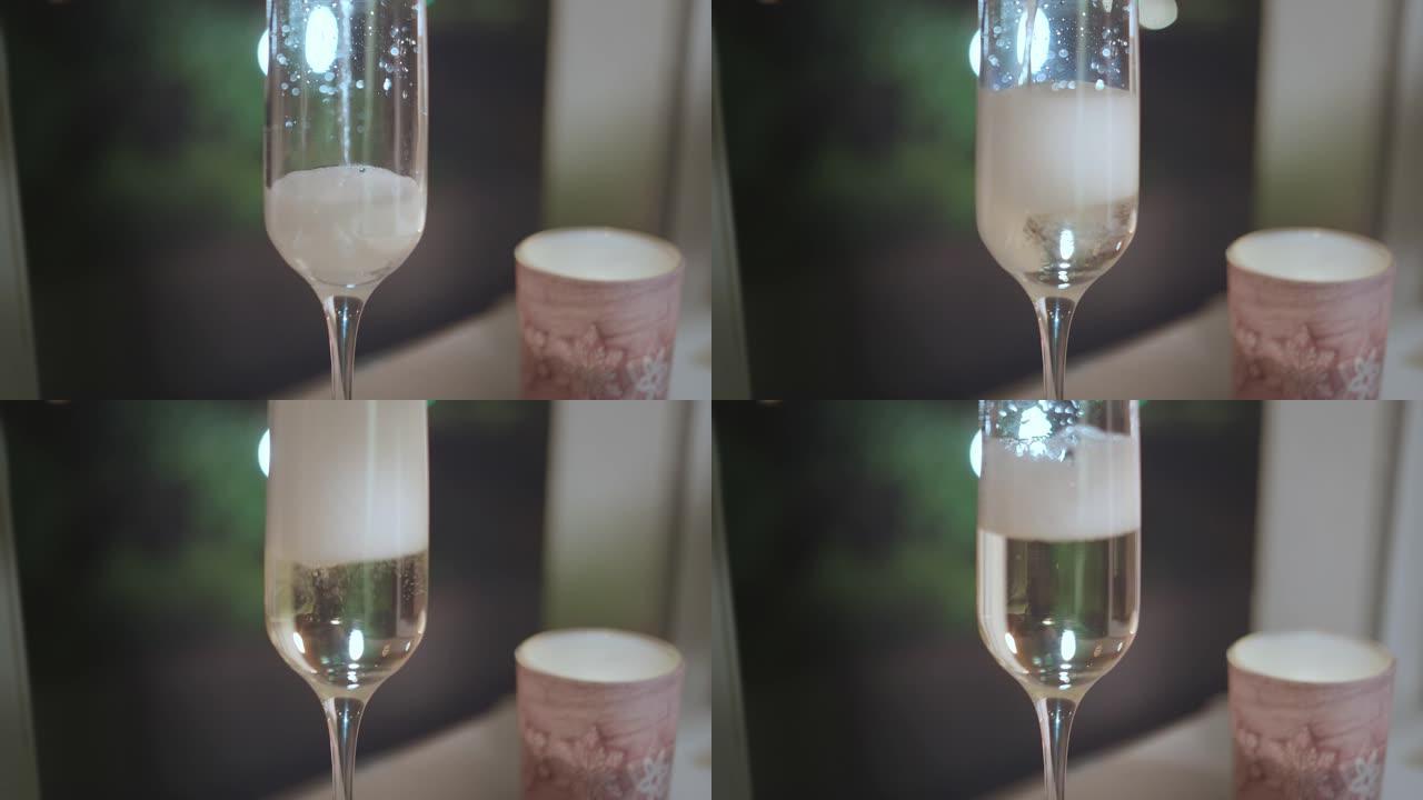 香槟在烛台旁边装满玻璃杯，夜灯背景