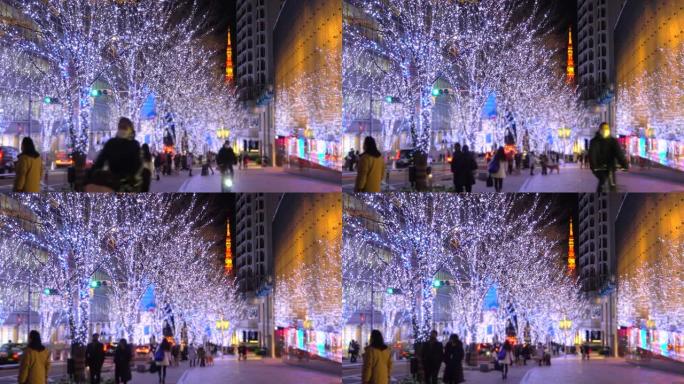 六本木榉坂的圣诞灯和人们，可以看到东京塔。