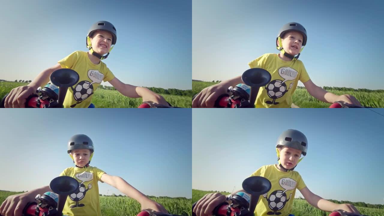 小男孩骑自行车玩得开心