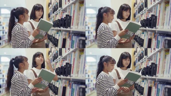 两个年轻的青春期女孩一起读教科书