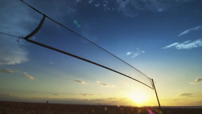 日落沙滩排球网剪影