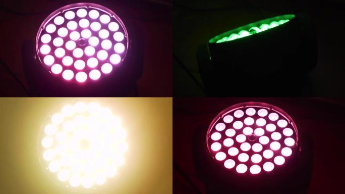用彩色自动旋转RGB投影仪水晶发光二极管在黑暗中发光。夜总会照明设备镜头
