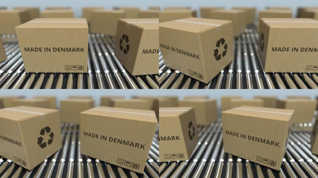 滚筒输送机上带有丹麦制造文本的盒子