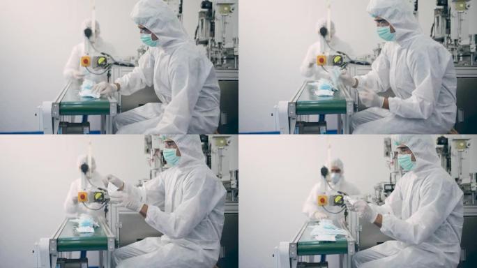 PPE套件质量控制自动化制造医用口罩预防冠状病毒的工程师。