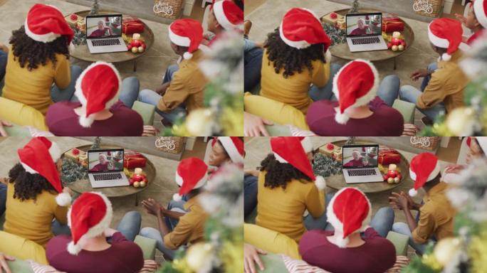 拥有圣诞老人帽子的多元化家庭使用笔记本电脑进行圣诞节视频通话，屏幕上有微笑的朋友