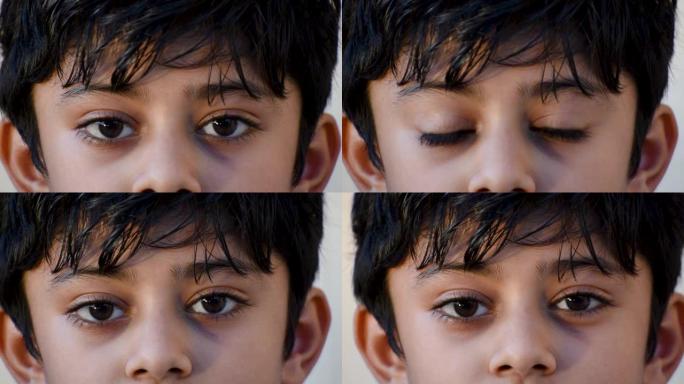 盯着相机的印度小孩的眼睛特写。