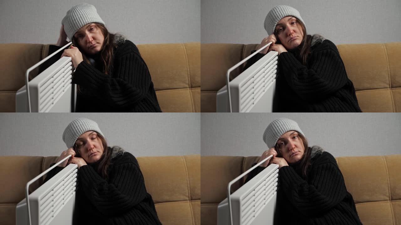 生病的女人感觉很冷，坐在加热器附近穿得很暖和