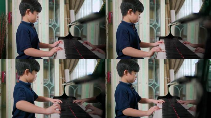 亚洲男孩在客厅弹奏三角钢琴的侧视图。选择性聚焦。孩子专心上课。爱好和在家学习。快乐的一天和家庭观念。